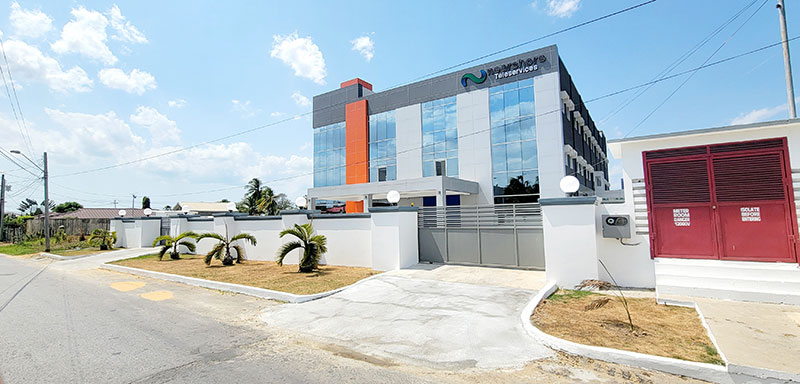 A building with orange and blue details, serving as a contact center.