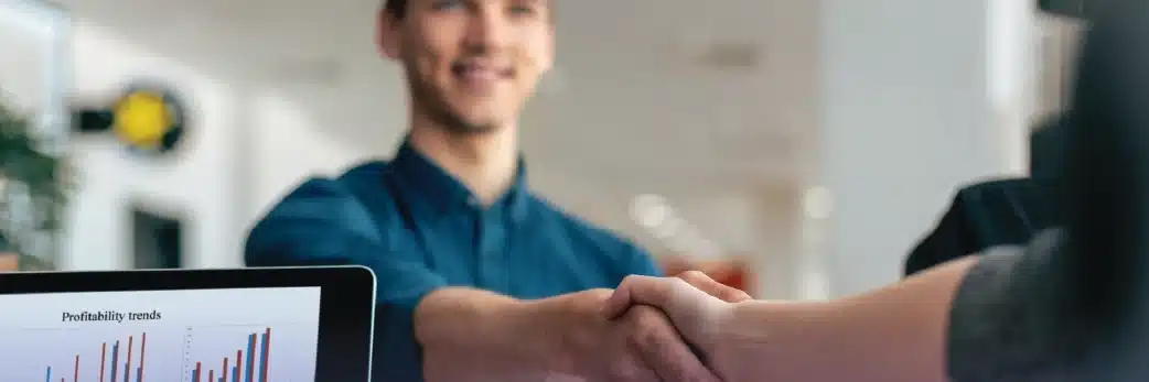 Two people shaking hands in BPO contact center